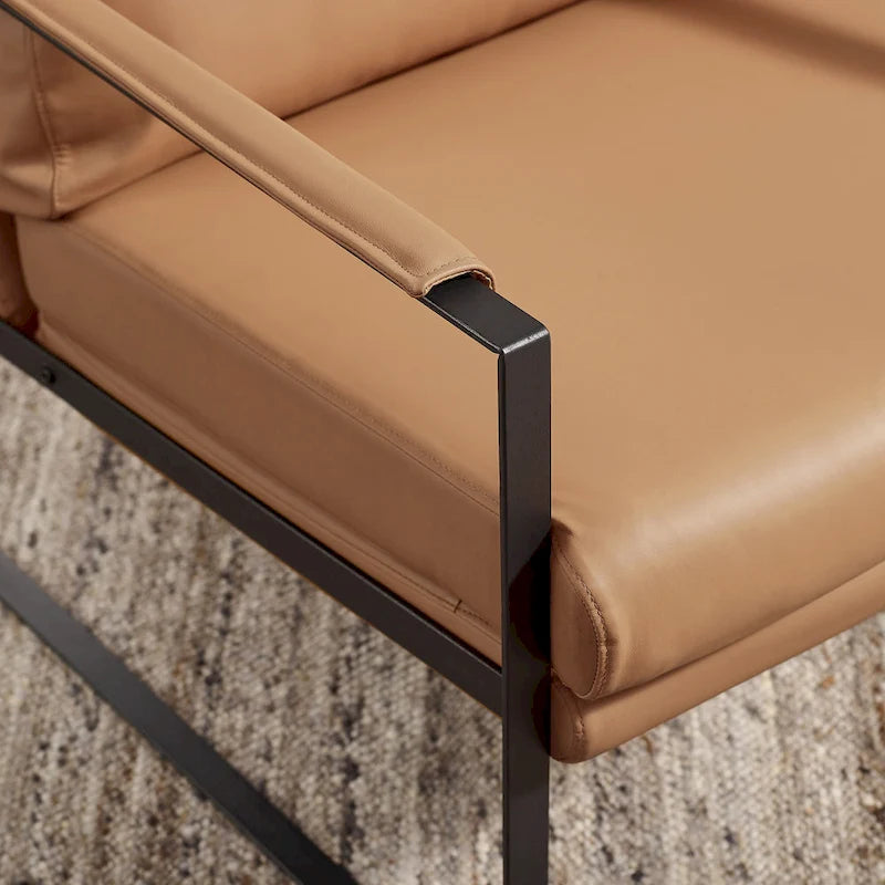 Moderne fauteuil in imitatieleer uit het midden van de vorige eeuw met stalen frame