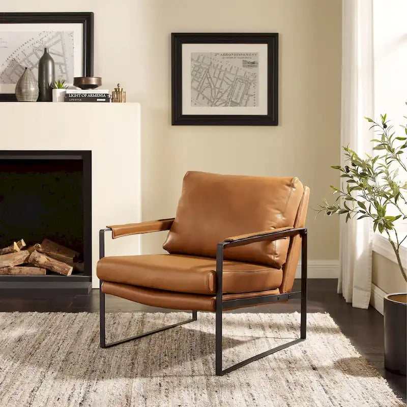 Moderne fauteuil in imitatieleer uit het midden van de vorige eeuw met stalen frame