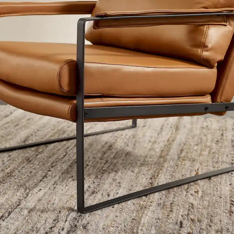 Moderne fauteuil in imitatieleer uit het midden van de vorige eeuw met stalen frame